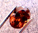garnet_cc_218pt_oval_smky-orang_red-orange