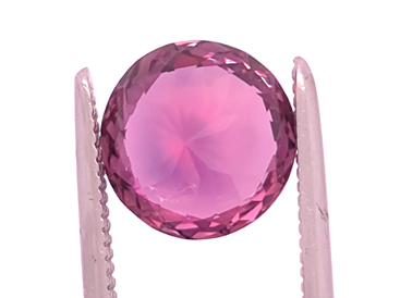 back of reddish pink Montana Sapphire