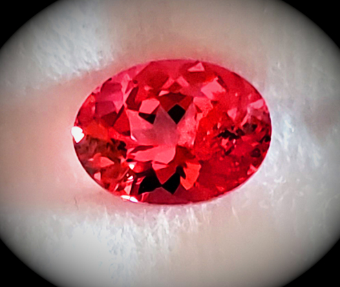1.32ct mahenge spinel of a neon reddish-orange-pink color
