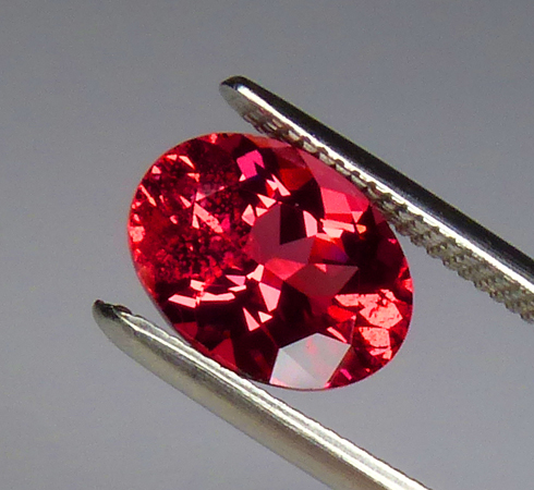 1.32ct mahenge spinel of a neon reddish-orange-pink color