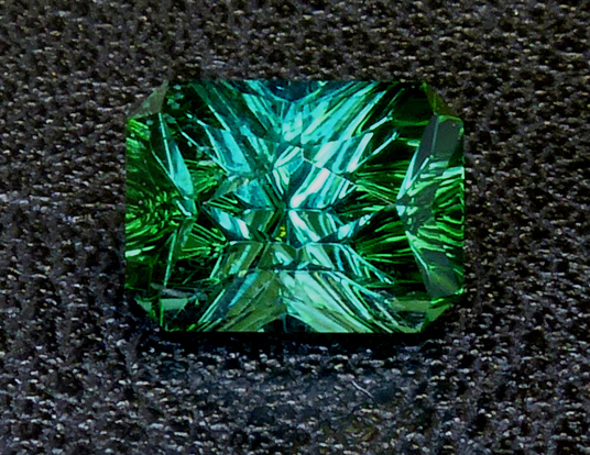 nuristani blue green concave cut tourmaline