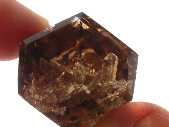 smoky quartz crystal with inclusions