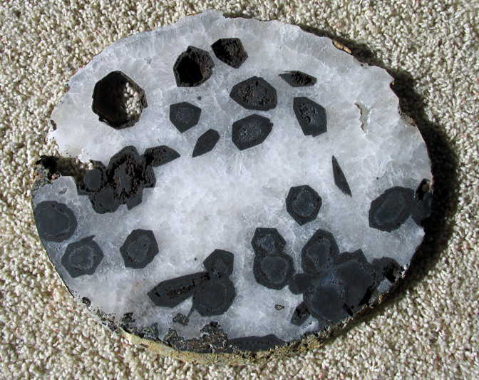 quartz geode slice with tourmaline crystals