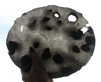 quartz geode slice with tourmaline crystals